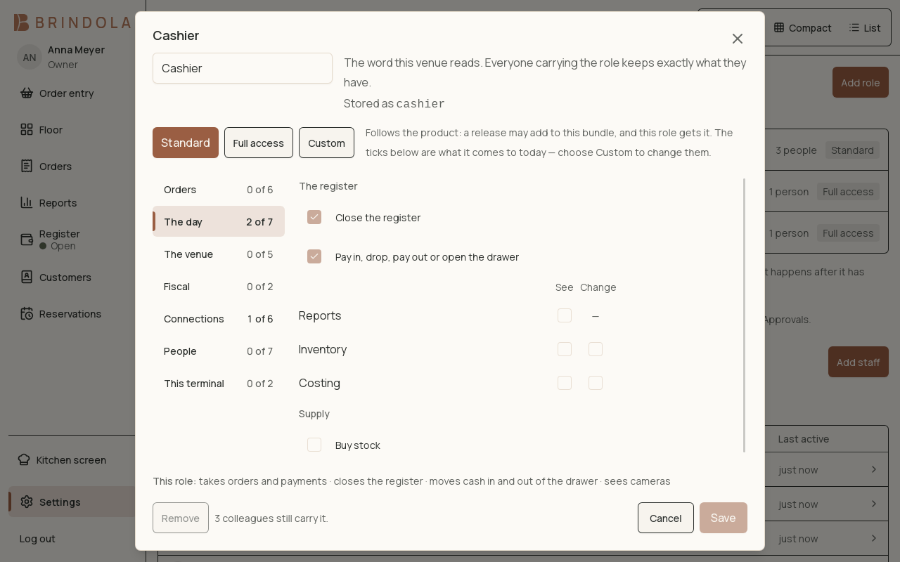 A role with its grouped permissions, open on the day's register grants. · Shown in English