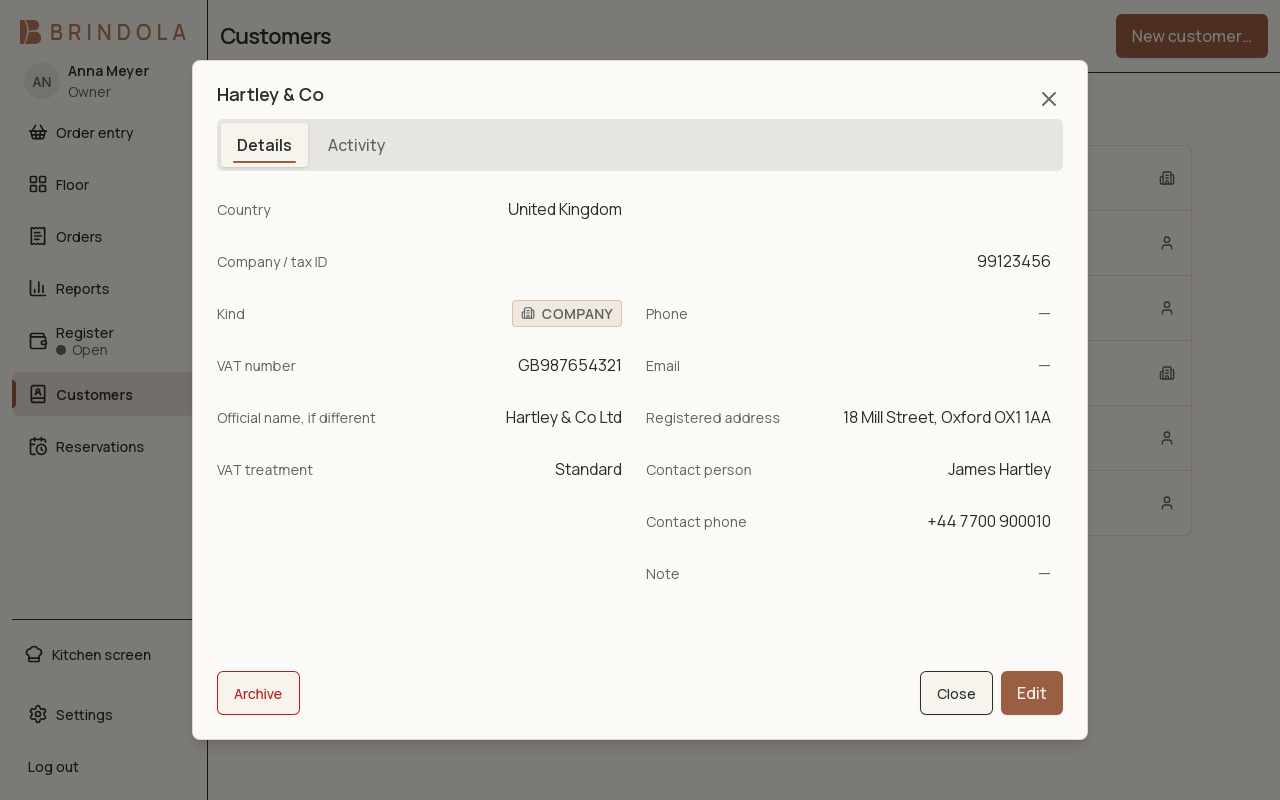 A customer record for a company, showing its legal name, tax number, VAT status and contact details. · shown in English
