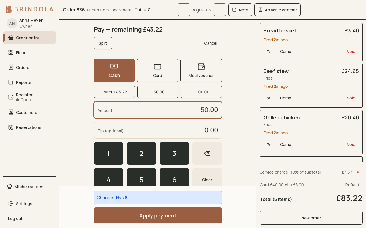 The payment screen showing a bill split across two tenders, a tip line and the change due. · shown in English